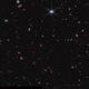 A region of sky near the Big Dipper, peppered with countless galaxies and stars.